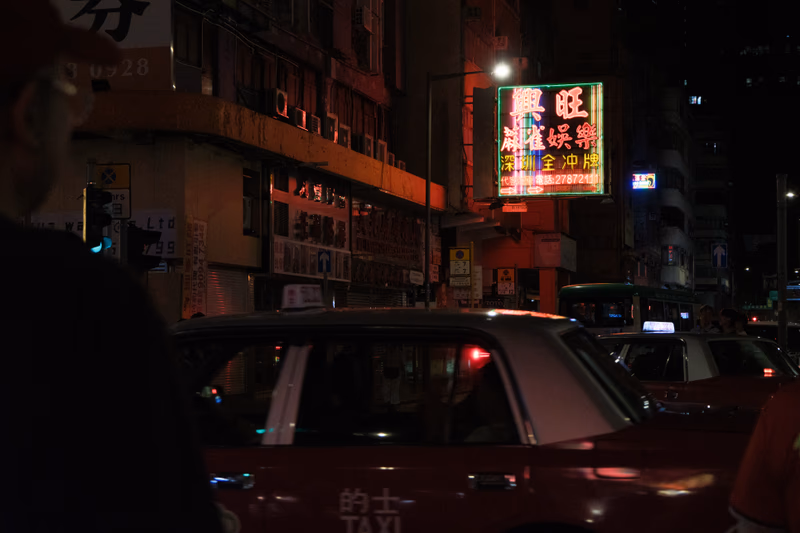 A night in the city, a taxi, and the neon lights of Mong Kok.